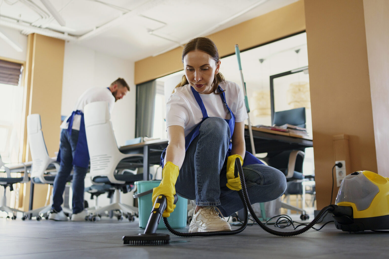 Home professional cleaning service person using vacuum cleaner office